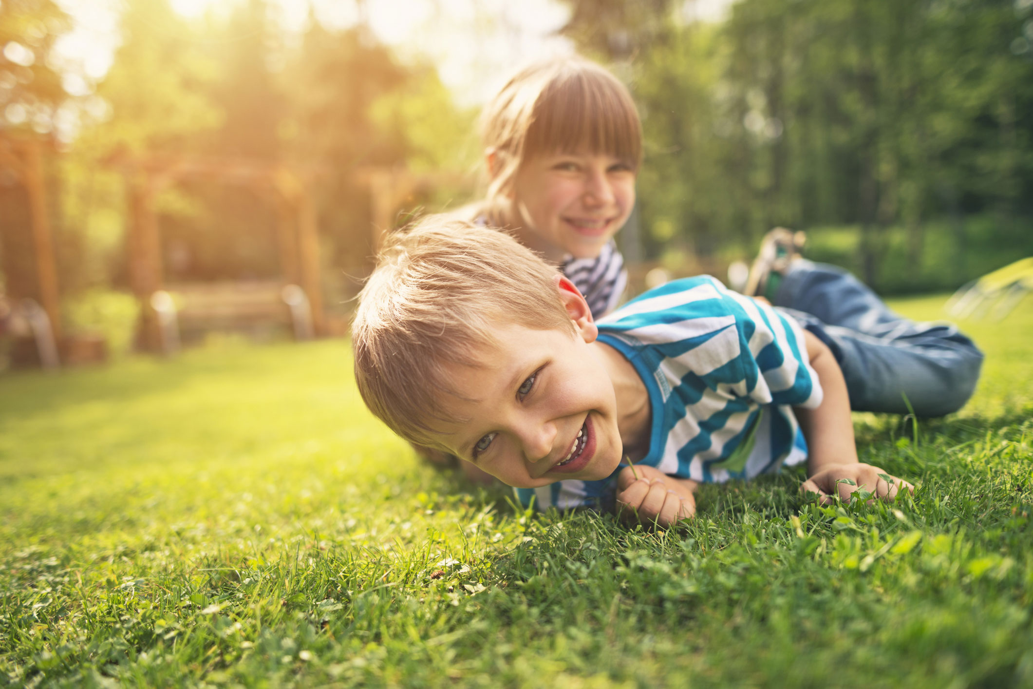 Two children playing on grass supplied by one of myhomeTURF's local growers.