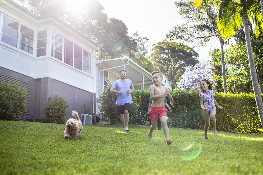 Family Playing in their backyard